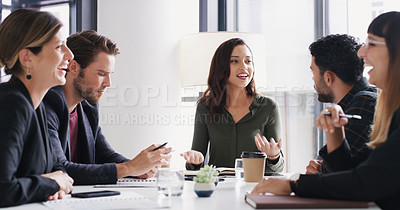 Buy stock photo Shot of a group of businesspeople having a meeting in a boardroom