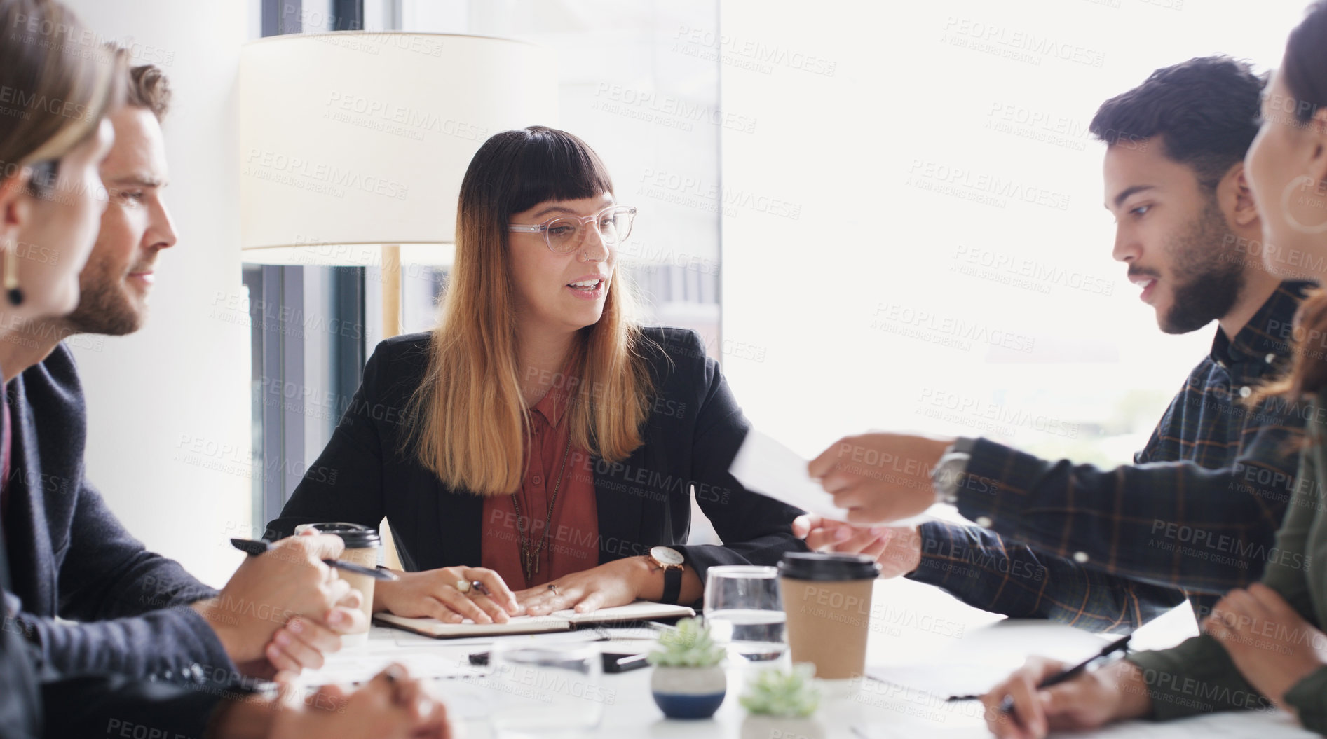 Buy stock photo Shot of a group of businesspeople having a meeting in a boardroom