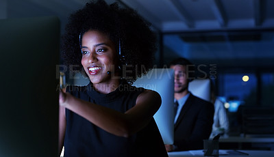 Buy stock photo Cropped shot of an attractive young businesswoman sitting in her office and wearing a headset while working on her computer