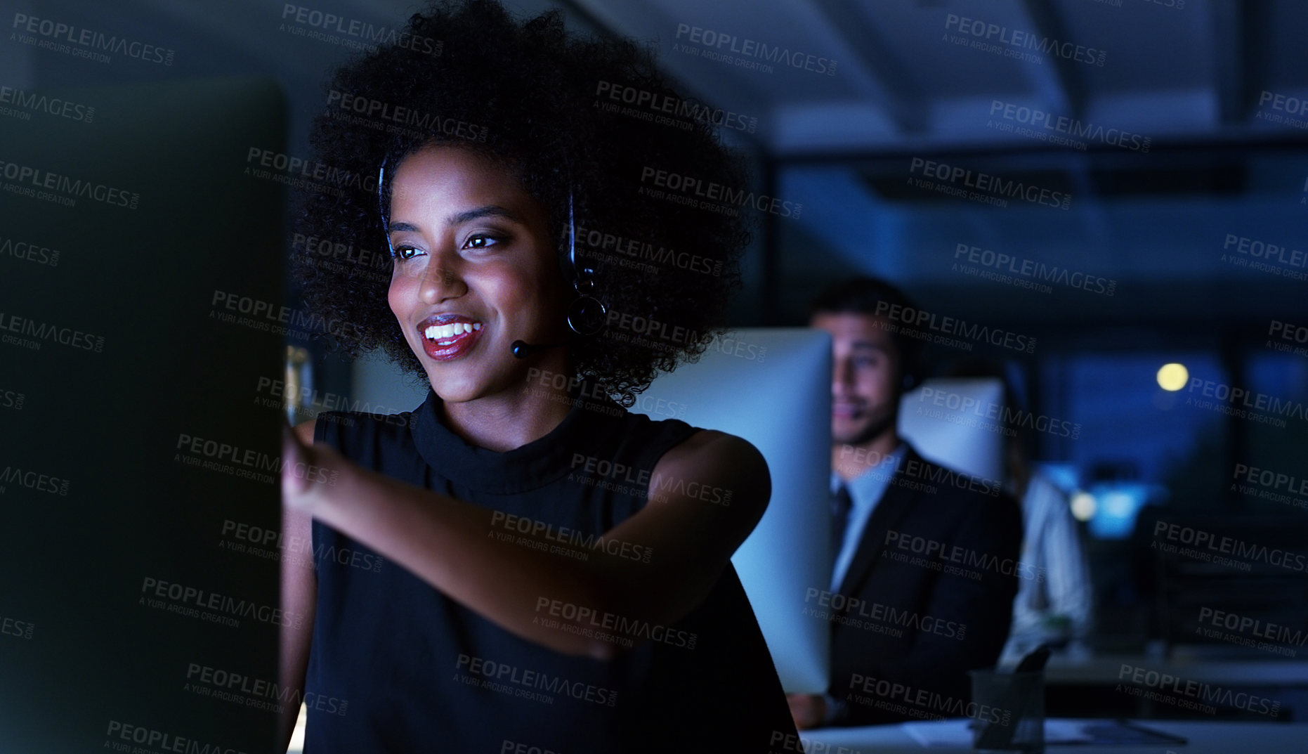 Buy stock photo Cropped shot of an attractive young businesswoman sitting in her office and wearing a headset while working on her computer