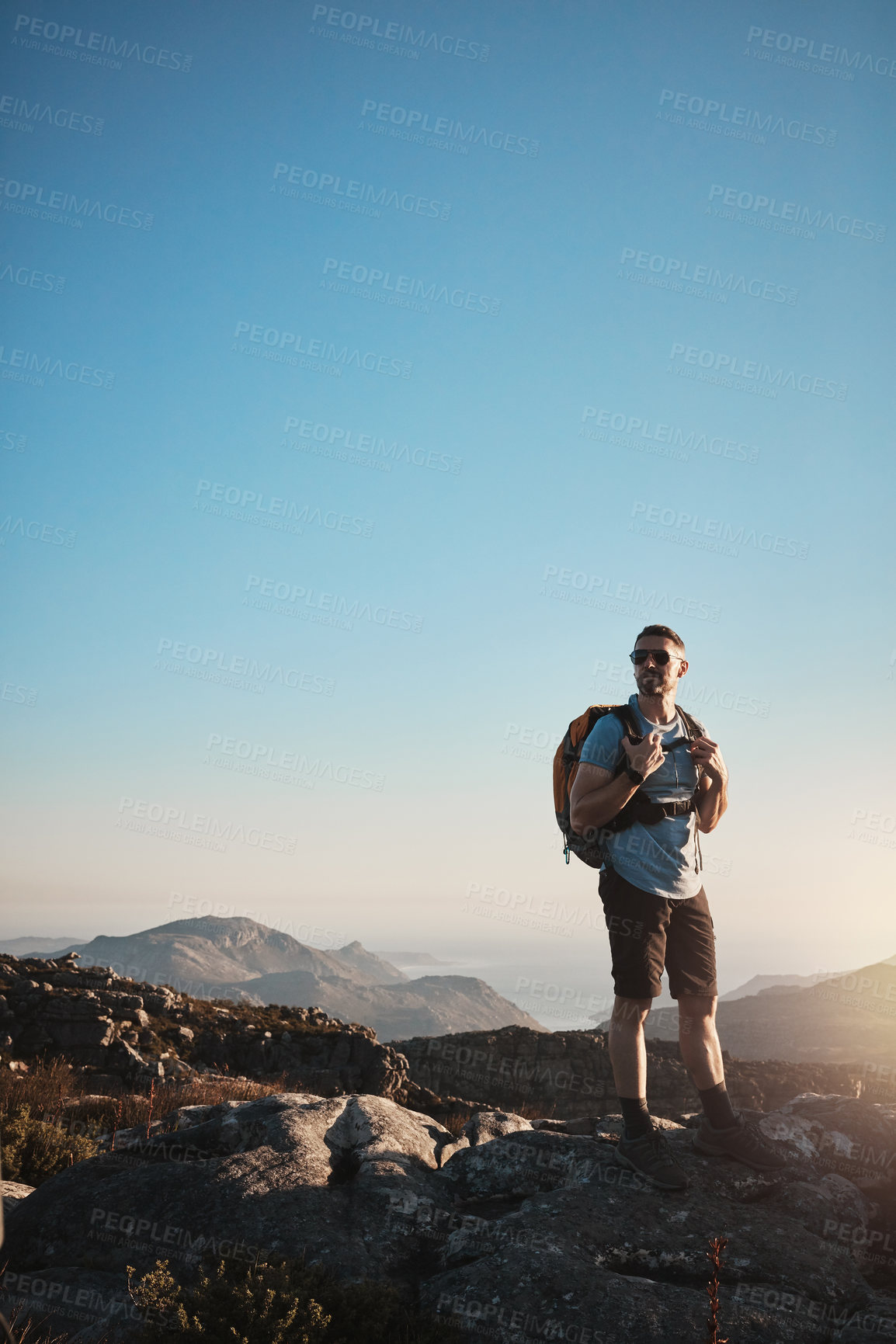 Buy stock photo Hiking, man and mountain on peak outdoor for fitness travel, adventure view and backpack journey in summer. Male hiker, backpacking and trekking for cardio exercise, rock climbing and health wellness