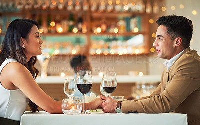 Buy stock photo Couple holding hands, romantic date in restaurant, celebrate Valentines day holiday with love and fine dining together. Commitment, interracial relationship and man with woman, trust and support
