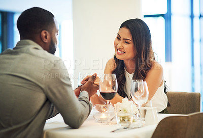 Buy stock photo Wine, date and interracial couple holding hands for fine dining, restaurant or valentines celebration together. Black man, asian woman and alcohol glasses for romance, wealth or luxury anniversary