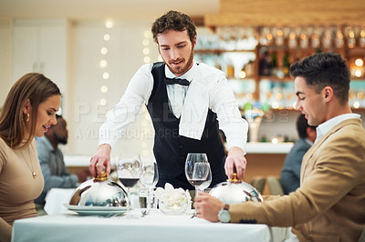 Buy stock photo Couple, restaurant server and fine dining with food for valentines day date, love and romance in night. Man, woman and waiter with service, party and hospitality for dinner, bonding and celebration