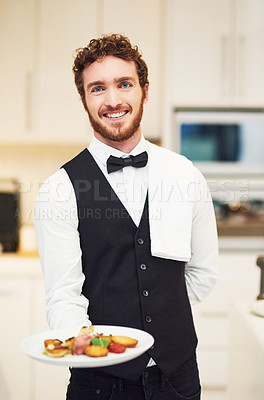 Buy stock photo Male, restaurant waiter and plate in portrait for fine dining service, happy and pride for food industry job. Man, server and working in kitchen, luxury diner and hospitality with dinner services
