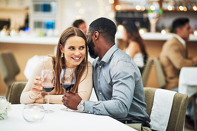Buy stock photo Restaurant date, interracial couple secret and wine celebration of a man at a dinner table. Anniversary happy, valentines day smile and drink at night with love, care and conversation together 