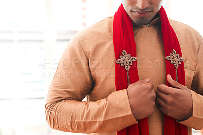 Buy stock photo Cropped shot of a young man getting dressed on his wedding day