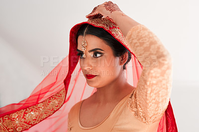 Buy stock photo Shot of a beautiful young woman getting ready for her wedding