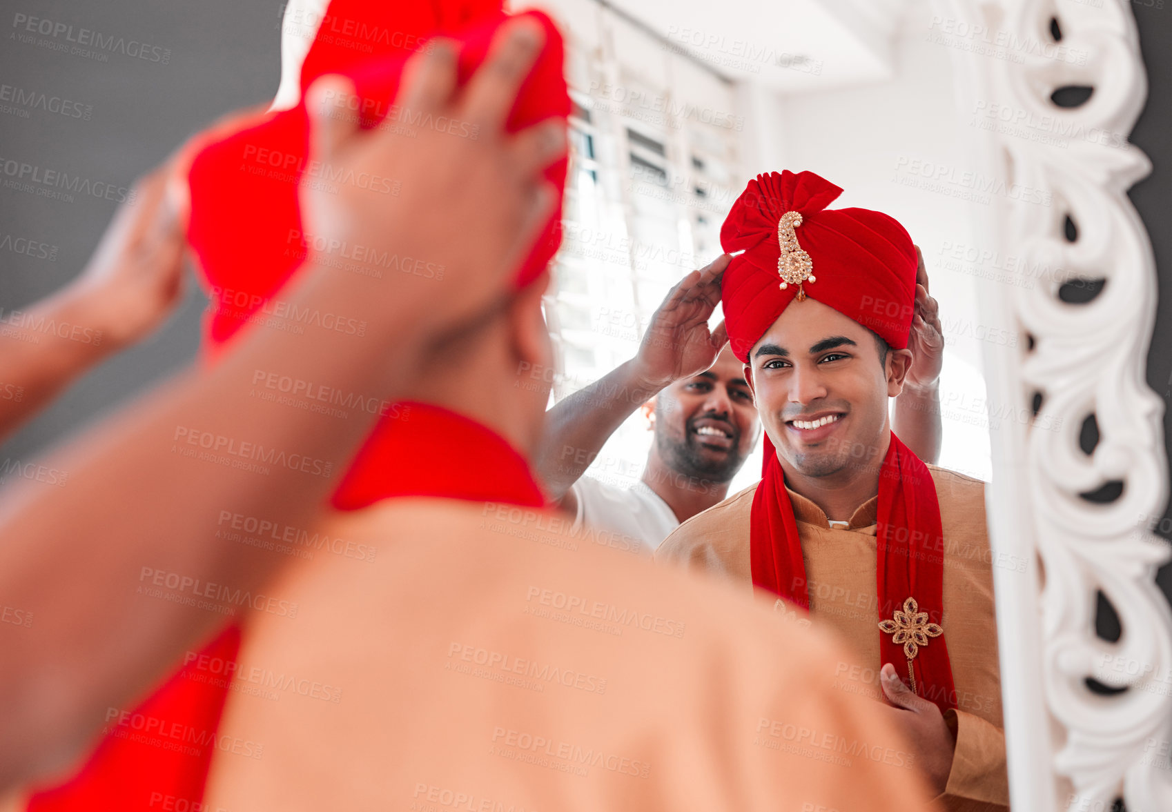 Buy stock photo Shot of a young man helping his friend get dressed on his wedding day