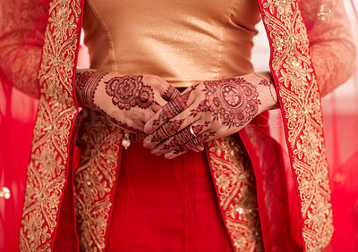 Buy stock photo Cropped shot of an unrecognizable woman with mehendi painted on her hands on her wedding day