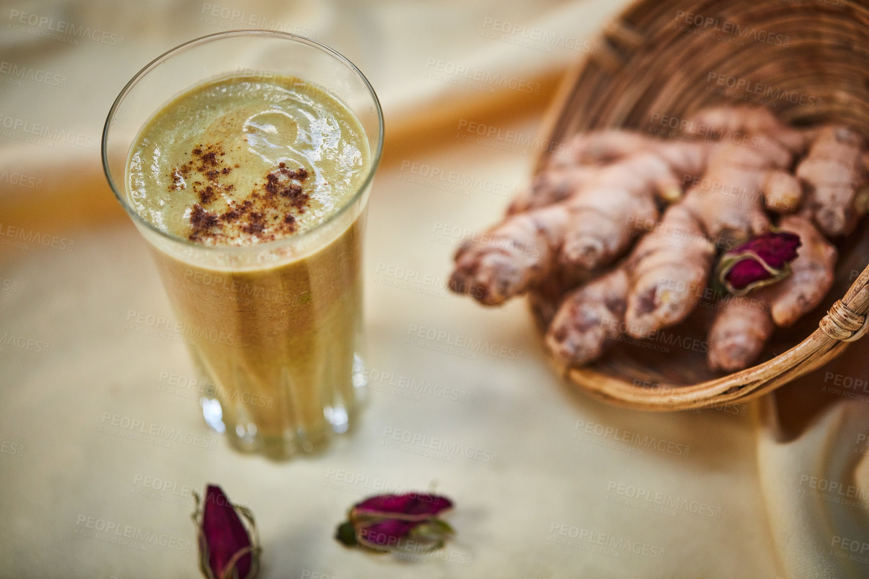 Buy stock photo Shot of a freshly made ginger smoothie on a table