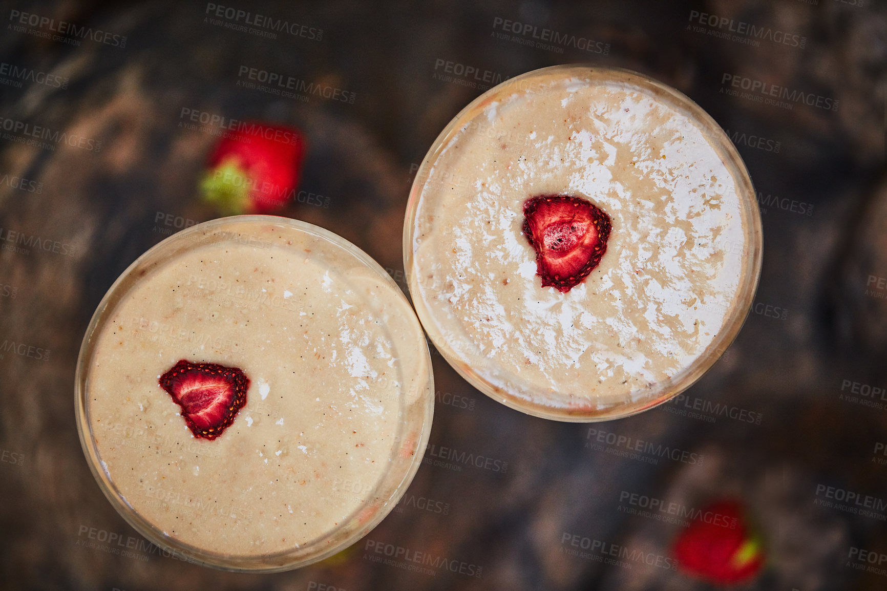 Buy stock photo Shot of a freshly made cream snack served in a glass with strawberries on a table