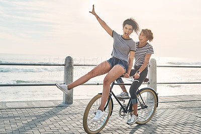 Buy stock photo Bike, friends and celebration with women on vacation for sports, fun and summer break. Health, joy and wellness for cyclists riding bicycle on promenade for relaxing, Miami travel or freedom together