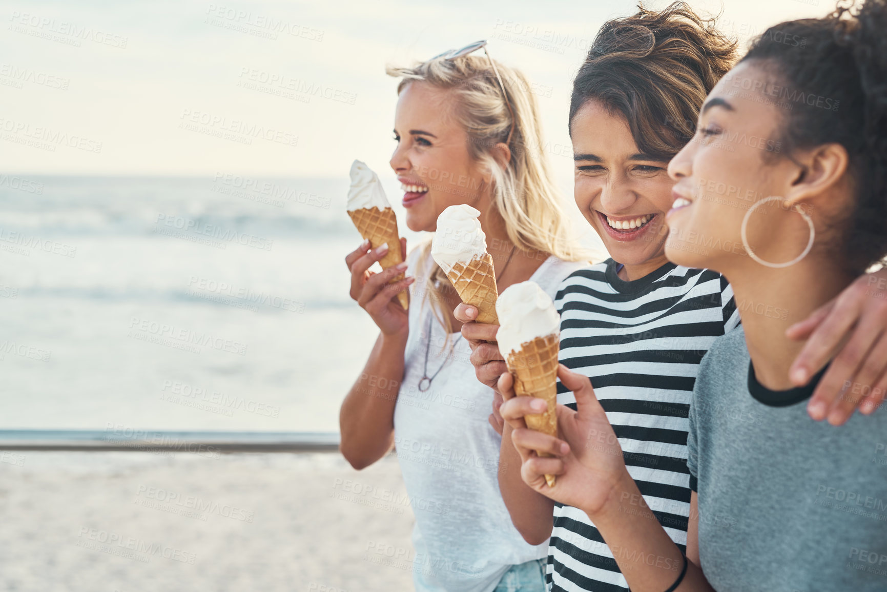 Buy stock photo Friends, girls and laugh with ice cream outdoor for fun bonding, hungry and sugar dessert in summer together. Group, women and embrace for gelato snack, funny joke and enjoy food for care on beach