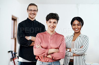 Buy stock photo Cropped portrait of a diverse group of businesspeople standing in the office together with their arms folded
