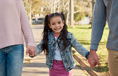 Buy stock photo Girl, portrait and happy in holding hands in park on school, holiday or vacation on weekend for growth. Family, bonding and childhood development in nature with smile for memory, together and support