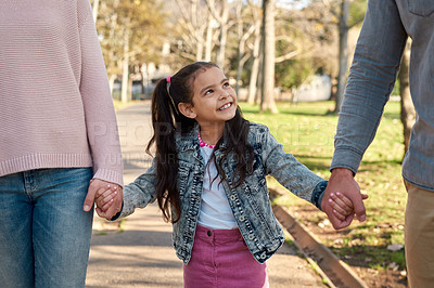 Buy stock photo Shot of an adorable little girl going for a walk in the park with her parents