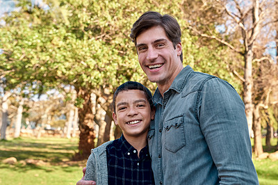 Buy stock photo Shot of a young boy spending quality time with his father at the park