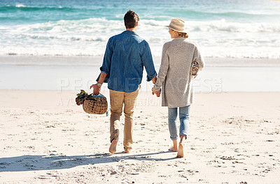 Buy stock photo  Holding hands, beach and couple in walking, back and holiday for vacation, ocean and adventure.  Romantic, summer and picnic basket in bali, bonding and sea or outdoor, mockup and romance on sand