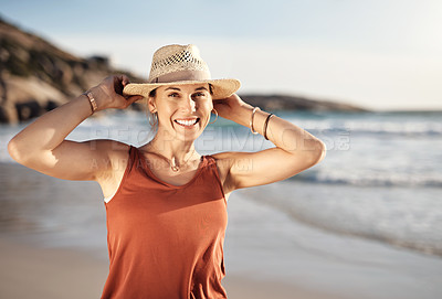 Buy stock photo Cropped shot of a middle aged woman spending the day at the beach