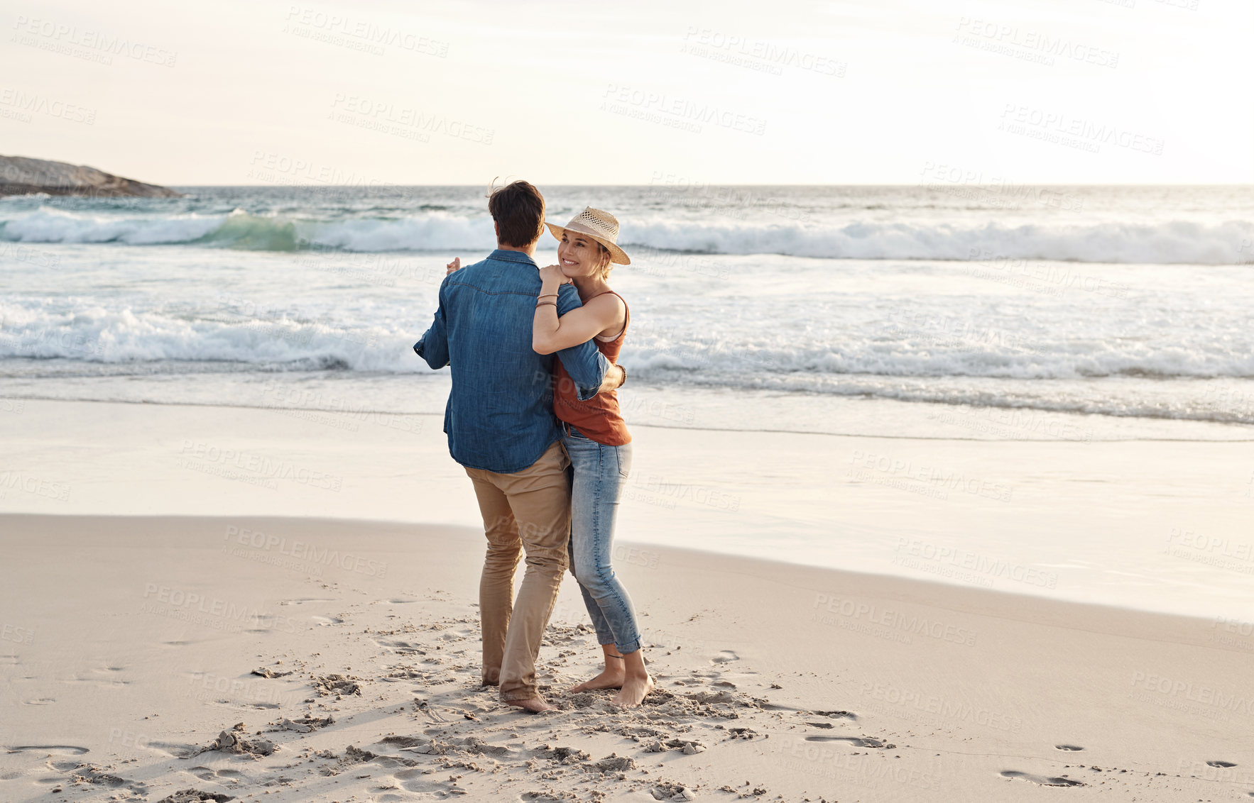 Buy stock photo Couple, dancing and happy hugging on beach, seaside and holiday for relationship bonding and love or affection. Ocean, calm and fun with partners on vacation trip, relax and movement for joy on date