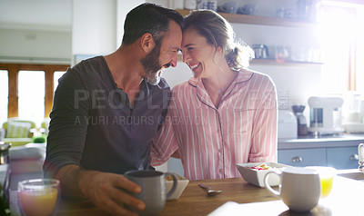 Buy stock photo Cropped shot of a middle aged couple having coffee in the morning