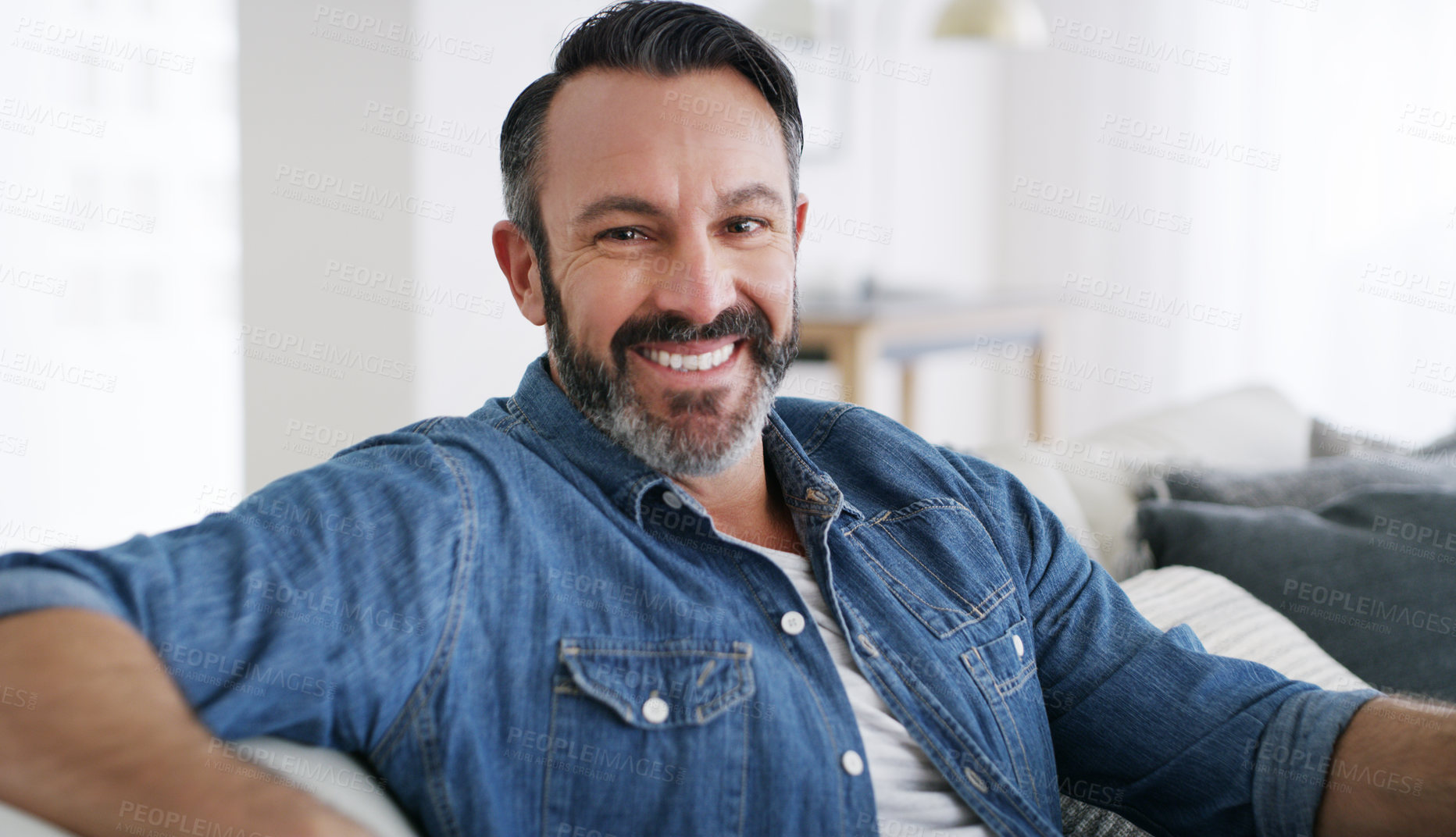 Buy stock photo Cropped shot of a middle aged man relaxing at home