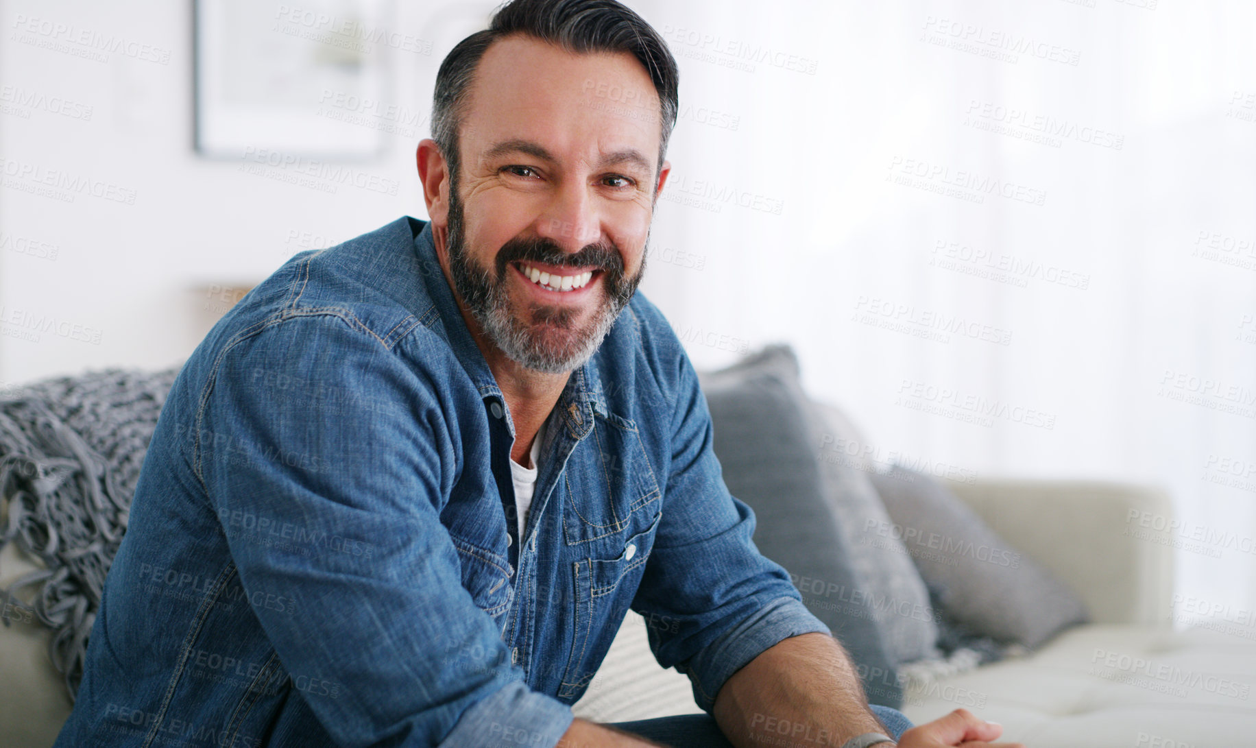 Buy stock photo Cropped shot of a middle aged man relaxing at home