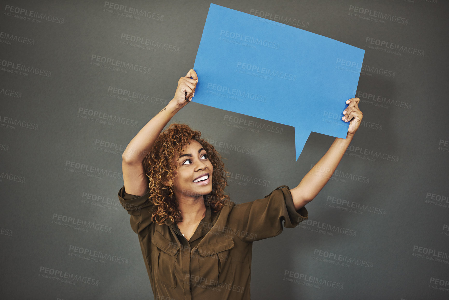 Buy stock photo Speech bubble, excited and person in studio with banner for news, announcement and feedback. Mockup space, social media and person with information, advertising or promotion poster on gray background