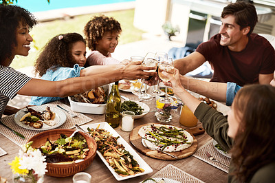 Buy stock photo Shot of a group of people sharing a meal