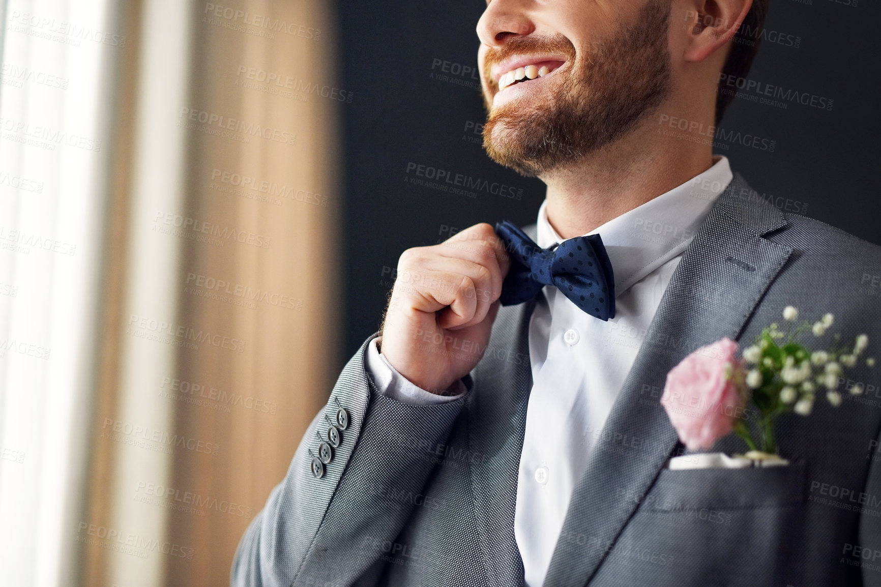 Buy stock photo Man, home and happy as groom with bowtie for wedding day, marriage and commitment. Male person, suit and smile or excited for celebration with love, care and trust in bedroom for preparation