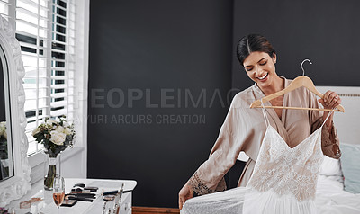 Buy stock photo Cropped shot of an attractive young bride getting ready for her wedding ceremony in her bedroom