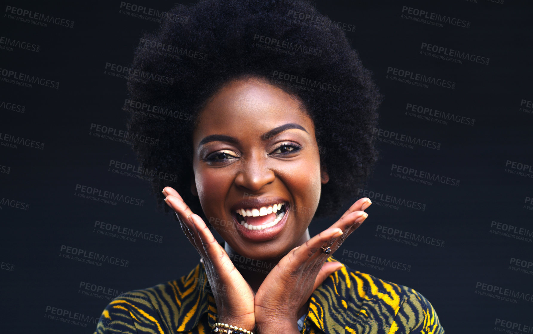 Buy stock photo Cropped shot of a happy young woman posing against a dark background