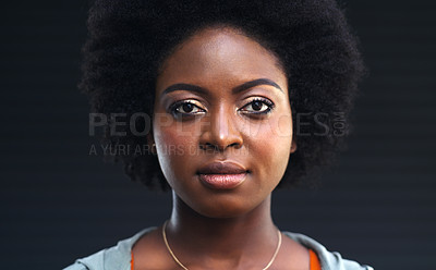 Buy stock photo Cropped shot of a young woman posing against a dark background