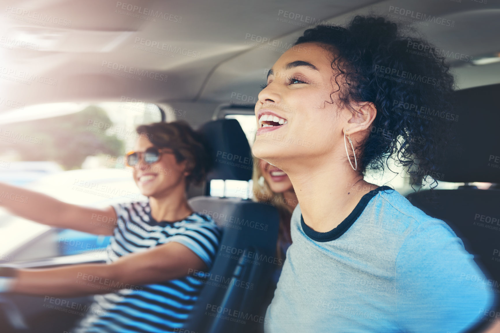 Buy stock photo Friends, women and smile with driving car on speed for fun on roadtrip, travel and holiday in Spain. People, vehicle and happy or excited for transportation with laughing for vacation and adventure