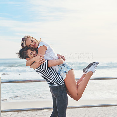 Buy stock photo Hug, happy and lesbian couple by beach on vacation, getaway or weekend trip for romance together. Love, summer and queer women embracing on promenade by ocean for romantic holiday in Australia.