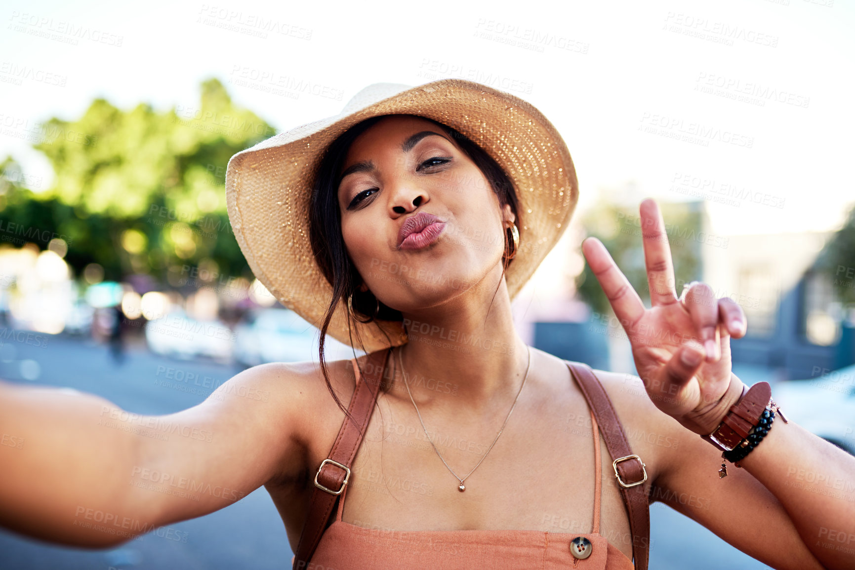 Buy stock photo Portrait of an attractive young woman taking selfies while out in the city