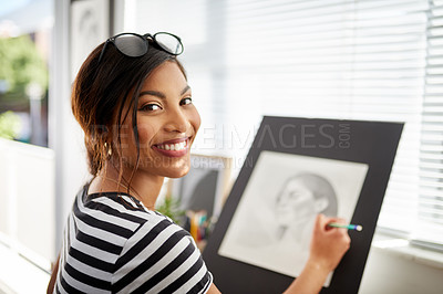 Buy stock photo Portrait of an attractive young artist drawing a portrait of a woman inside her studio