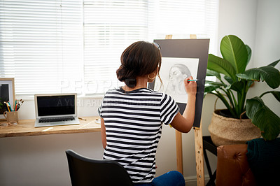 Buy stock photo Rearview shot of a young female artist drawing a portrait of a woman inside her studio