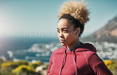 Buy stock photo Cropped shot of an attractive young woman out for a run