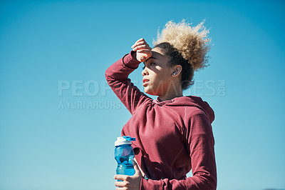 Buy stock photo Cropped shot of an attractive young woman out for a run