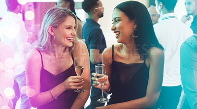 Buy stock photo Shot of two young women toasting with their drinks in a nightclub
