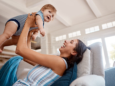 Buy stock photo Shot of a mother bonding with her baby boy at home