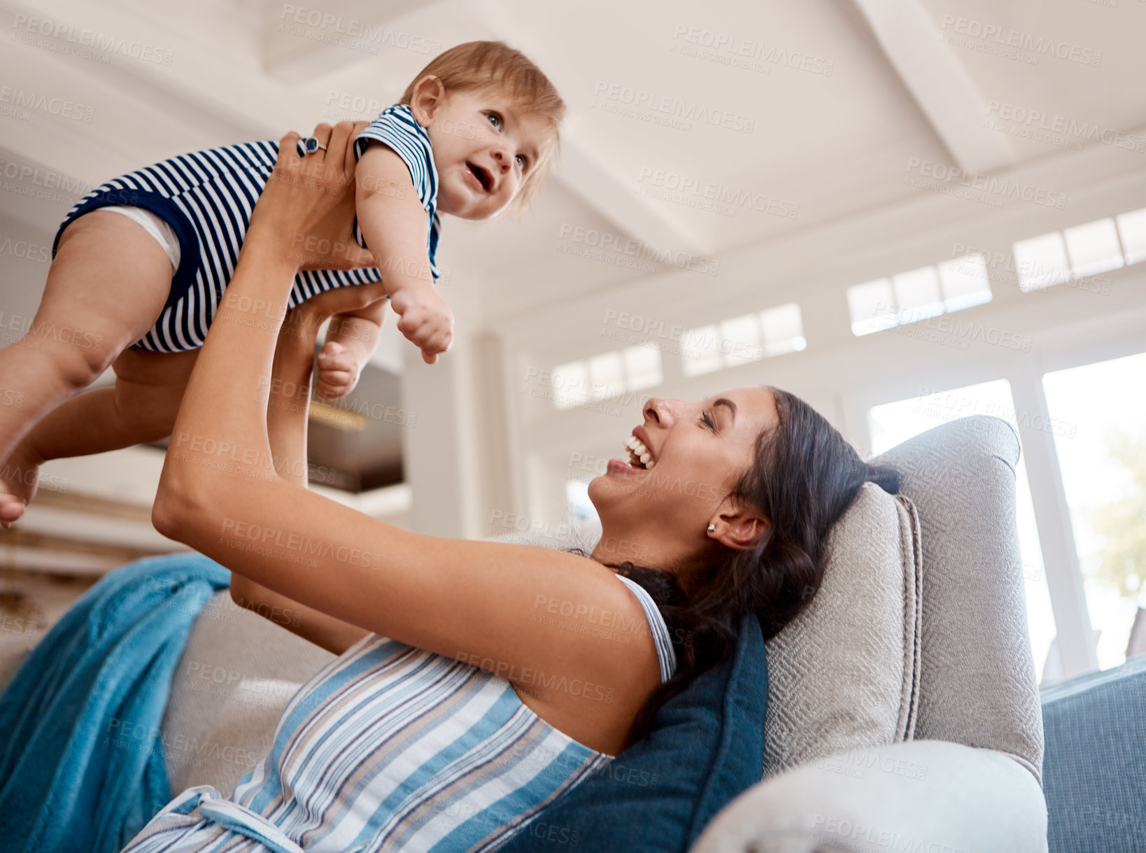 Buy stock photo Shot of a mother bonding with her baby boy at home