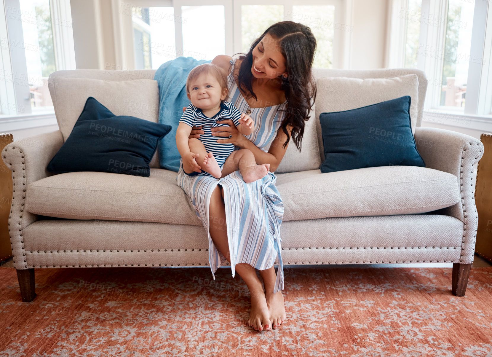 Buy stock photo Shot of a mother bonding with her baby boy at home