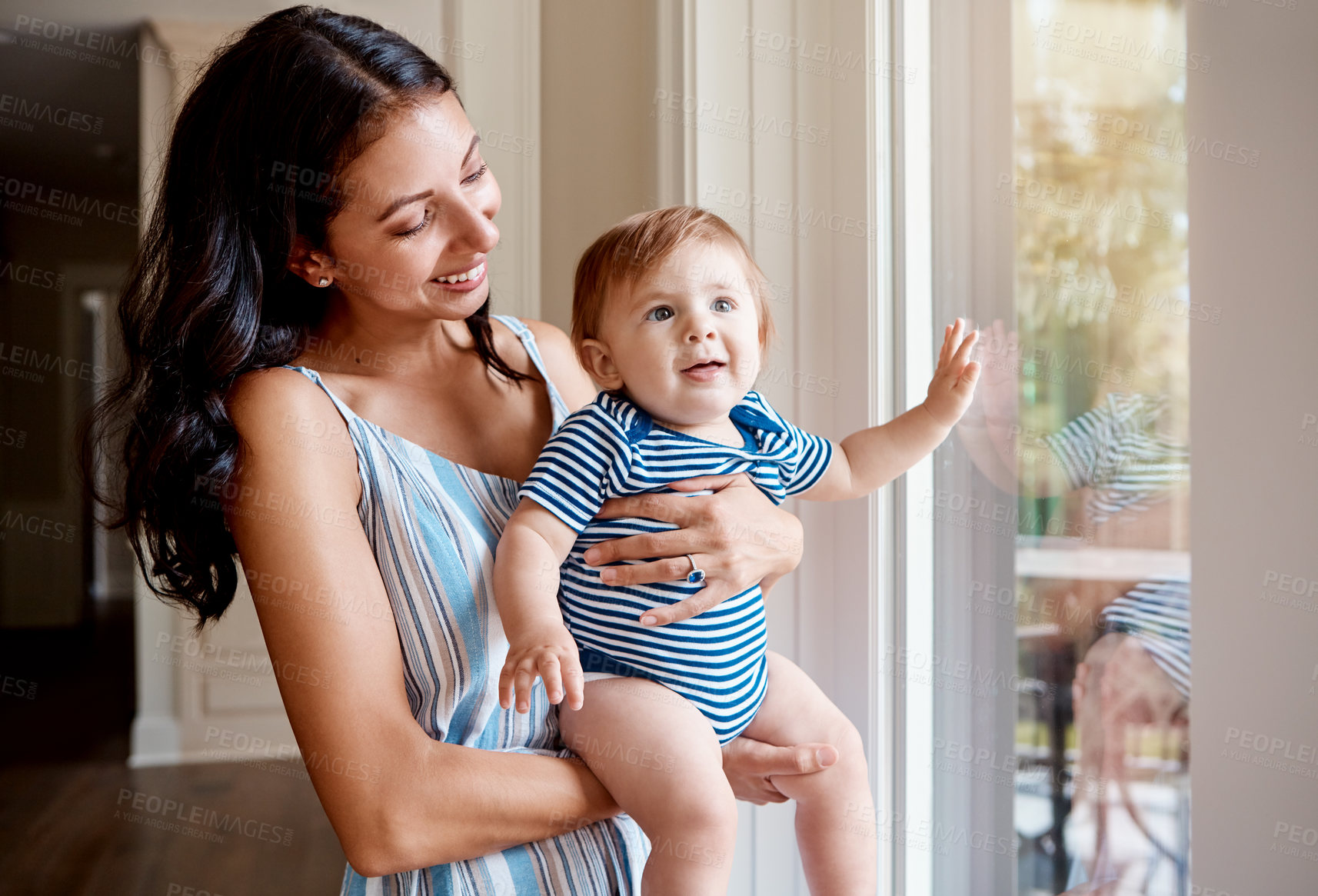 Buy stock photo Shot of a mother bonding with her baby boy at home