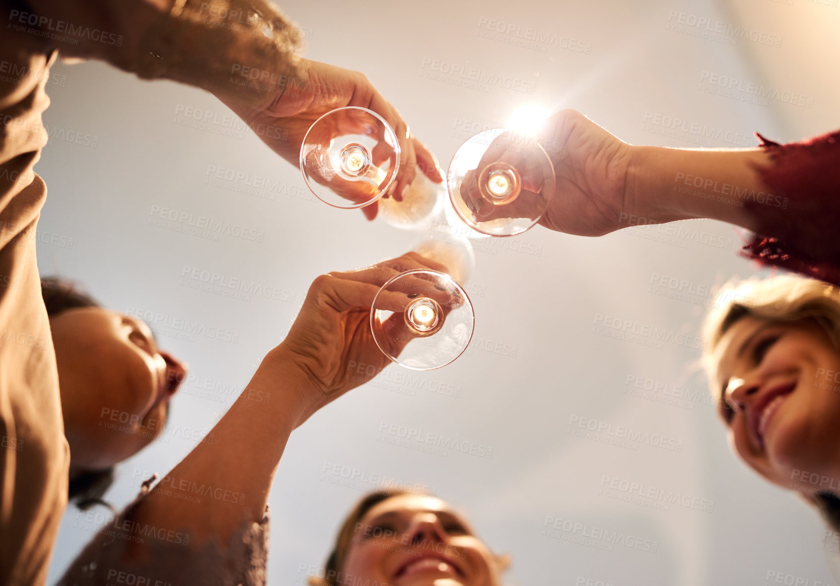 Buy stock photo People, smile and toast with champagne in glass for special event, reunion or celebration together. Women, friends and happy with alcohol in low angle for success, cheers or party on New Year at home