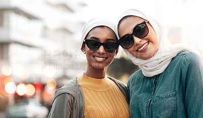 Buy stock photo Women friends, hijab and portrait in city with smile, sunglasses and support on street in Qatar. Islamic woman, together and freedom in metro with fashion, happy face and solidarity on travel
