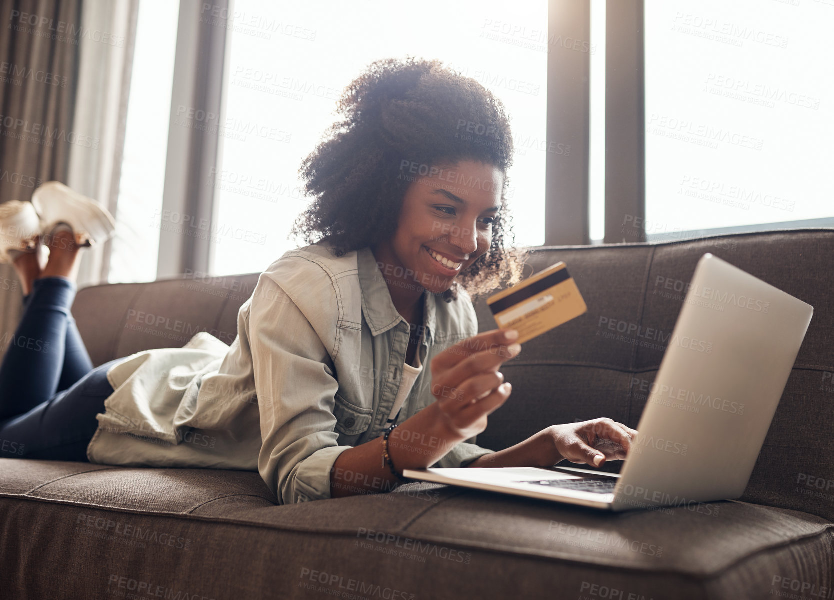 Buy stock photo Black woman, sofa and happy on laptop with credit card for online shopping, payment and saving plan. Living room, smile and couch at home for internet banking, budget and investment or finance