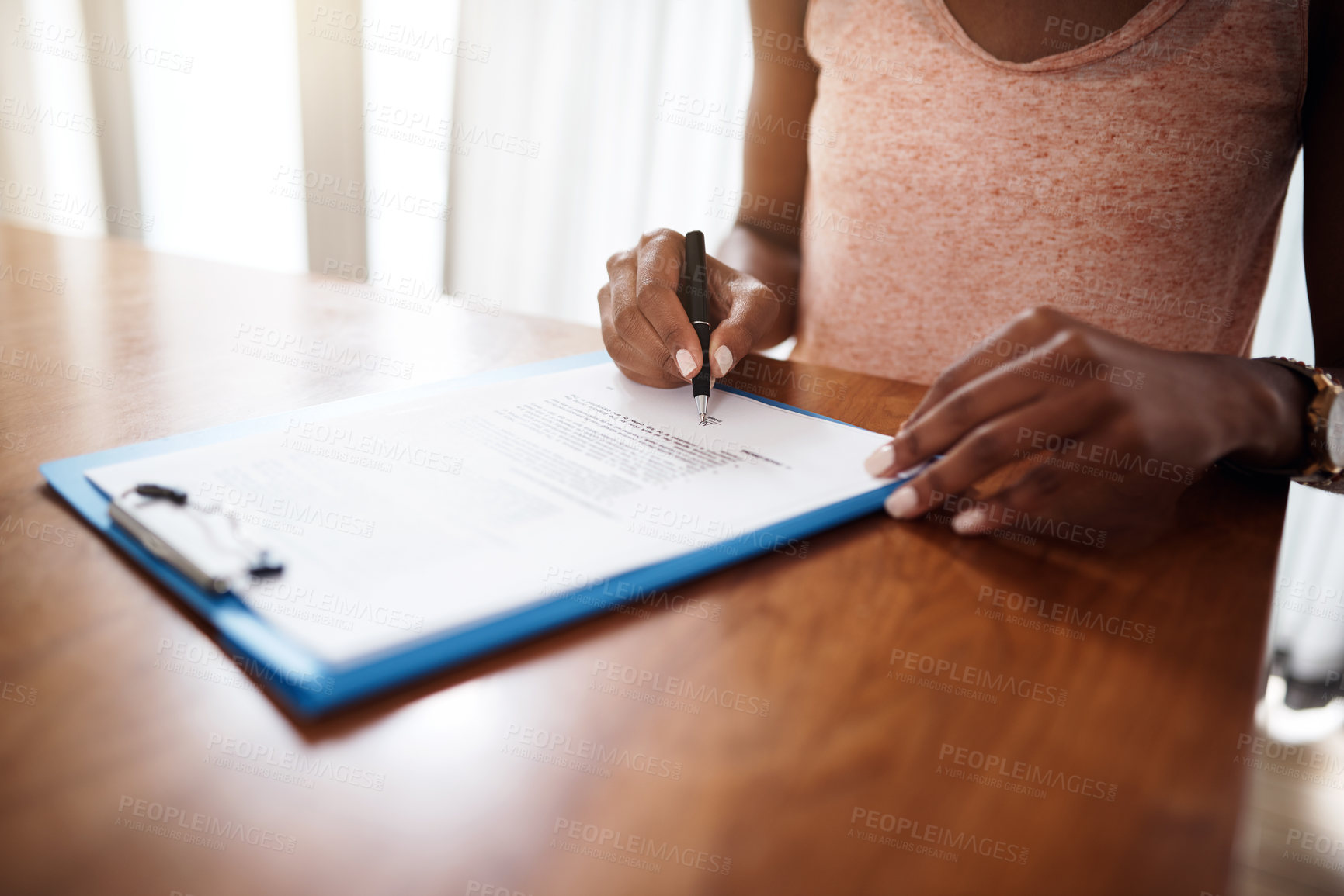 Buy stock photo Cropped shot of an unrecognizable woman signing a form